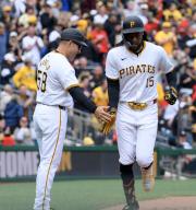 Pittsburgh Pirates shortstop Oneil Cruz (15) rounds third and celebrates with Pittsburgh Pirates third base coach and field coordinator Mike Rabelo (58) following his 427 foot homer in the third inning against the Chicago Cubs at PNC Park on Saturday May 11, 2024 in Pittsburgh. Photo by Archie Carpenter