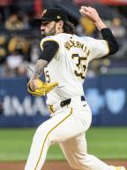 Pittsburgh Pirates pitcher Colin Holderman (35) throws after a long rain delay and walks in two additional runs for the Chicago Cubs in the fifth inning at PNC Park on Saturday May 11, 2024 in Pittsburgh. Photo by Archie Carpenter