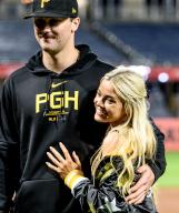 Pittsburgh Pirates pitcher Paul Skenes embraces his girlfriend Olivia Dunnen following the Pirates 10-9 win and his debut to the major leagues against the Chicago Cubs at PNC Park on Saturday May 11, 2024 in Pittsburgh. Photo by Archie Carpenter