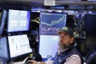 A trader wears a baseball cap reading "40,000" as he works on the floor of the New York Stock Exchange (NYSE) on Wall Street in New York City on Thursday, May 16, 2024. The Dow Jones Industrial Average briefly topped 40,000 for the first time today, closing at 39,965 in late trading. Photo by John Angelillo