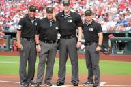Major League umpires (L to R) Jeremie Rehak, Bruce Dreckman, Clint Vondrak and Mark Wegner pose at home plate for a photograph before the Boston Red Sox-St. Louis Cardinals baseball game at Busch Stadium in St. Louis on Friday, May 17, 2024. Photo by Bill Greenblatt