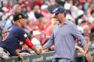 Former St. Louis Cardinals manager Mike Matheny (R) greets Boston Red Sox manager Alex Cora before a game between the Boston Red Sox and the St. Louis Cardinals at Busch Stadium in St. Louis on Friday, May 17, 2024. Photo by Bill Greenblatt