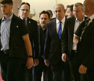 Israeli Prime Minister Benjamin Netanyahu walks in the Knesset, the Parliament, in Jerusalem, after the International Criminal Court