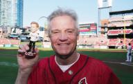 NASCAR Driver Kenny Wallace holds up his bobble head on Kenny Wallace Bobblehead Night before the Baltimore Orioles - St. Louis Cardinals baseball game at Busch Stadium in St. Louis on Monday, May 20, 2024. Photo by Bill Greenblatt