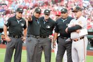 Major League umpires (L to R) Charlie Ramos, Eric Bacchus, Mike Estabrook and Liz Diaz, explain the ground rules of Busch Stadium to Baltimore Orioles coach Fredi Gonzalez and St. Louis Cardinals manager Oliver Marmot (second row) before a game in St. Louis on Monday, May 20, 2024. Photo by Bill Greenblatt
