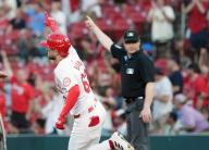 St. Louis Cardinals Michael Siani and first base umpire Mike Estabrook point to right field after Siani hit a three run home run in the fourth inning against the Baltimore Orioles at Busch Stadium in St. Louis on Monday, May 20, 2024. Photo by Bill Greenblatt
