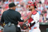 Home Plate umpire Laz Diaz pats the chest protector of St. Louis Cardinals catcher Ivan Herrera before a game with the Baltimore Orioles at Busch Stadium in St. Louis on Monday, May 20, 2024. Photo by Bill Greenblatt