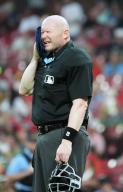 Home Plate umpire Mike Estabrook towels off between innings of the Baltimore Orioles - St. Louis Cardinals baseball game at Busch Stadium in St. Louis on Tuesday, May 21, 2024. Photo by Bill Greenblatt