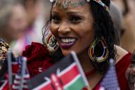A woman smiles holding American and Kenyan flags before President Joe Biden welcomes President of the Republic of Kenya William Ruto to the White House during an arrival ceremony on the South Lawn of the White House in Washington, DC on Thursday, May 23, 2024. Ruto