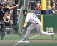 Pittsburgh Pirates second base Jared Triolo (19) makes the catch on the third base line and throws to first for the out against the San Francisco Giants in the fifth inning against the Pittsburgh Pirates at PNC Park on Thursday May 23, 2024 in Pittsburgh. Photo by Archie Carpenter