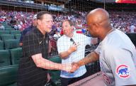 Missouri Head Football Coach Eliah Drinkwitz (L) introduces Chicago Cubs third base coach Willie Harris to new Missouri Athletic Director Laird Veatch before the Chicago Cubs-St. Louis Cardinals baseball game at Busch Stadium in St. Louis on Saturday, May 25, 2024. Photo by Bill Greenblatt