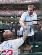Missouri Head Football Coach Eliah Drinkwitz says hello to Chicago Cubs third base coach Willie Harris before the Chicago Cubs-St. Louis Cardinals baseball game at Busch Stadium in St. Louis on Saturday, May 25, 2024. Photo by Bill Greenblatt