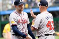 Atlanta Braves manager Brian Snitker (43) congratulates Atlanta Braves pitcher Dylan Lee (52) following the 8-1 win over the Pittsburgh Pirates at PNC Park on Sunday May 26, 2024 in Pittsburgh. Photo by Archie Carpenter