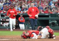 St. Louis Cardinals manager Oliver Marmot and head trainer Adam Olsen run to the aid of catcher Ivan Herrera after being struck by a baseball in the fourth inning against the Chicago Cubs at Busch Stadium in St. Louis on Sunday, May 26, 2024. Herrera remained in the game. Photo by Bill Greenblatt