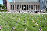 Small American flags, 570, line the grass area across from Soldiers Memorial during a Memorial Day service in St. Louis on Monday, May 27, 2024. Photo by Bill Greenblatt