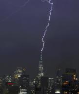 A lightning bolt lights up the Manhattan skyline and strikes the spire of One World Trade Center during a thunder storm in New York City on Wednesday, May 29, 2024. Photo by John Angelillo