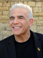 Yair Lapid, Israeli Opposition leader, attends the "Born To Be Free" Jerusalem Pride and Tolerance Parade amid the war with Hamas, calling for the release of all hostages held captive by Hamas in Gaza on Thursday, in Jerusalem, May 30, 2024. The solemn parade led by the Hostages and Missing Families Forum and the Jerusalem Open House for LGBTQ Israeli Jews and Arabs demands the release of the 121 hostages held for 237 days by Hamas. Photo by Debbie Hill