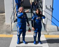 NASA Astronauts Butch Wilmore (l) and Suni Williams walk out from the Operations and Checkout Building at the Kennedy Space Center, Florida on Saturday, June 1, 2024. The two crew members will fly the Boeing Starliner spacecraft on its maiden crewed flight to the International Space Station. Photo by Joe Marino