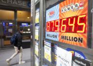 A display at a street stand shows the Mega Millions jackpot at $875 million dollars and Powerball jackpot at $645 million dollars on Wall Street on Monday, March 18, 2024 in New York City. Photo by John Angelillo