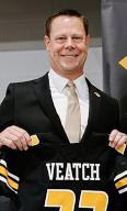 Laird Veatch hold a football jersey after being introduced as the new Athletic Director at the University of Missouri during a press conference in Columbia, Missouri on Friday, April 26, 2024. Veatch has served in the same role at the University of Memphis since October 2019. Photo by University of Missouri