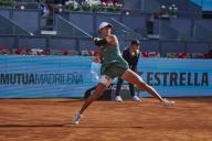 VCG111492571372 MADRID, SPAIN - APRIL 23: Wang Xiyu of China returns a shot in the Women\'s Singles Round of 128 match against Ana Bogdan of Romania on day one of Mutua Madrid Open 2024 at La Caja Magica on April 23, 2024 in Madrid, Spain. (Photo by VCG\/VCG