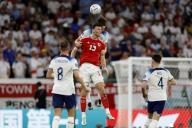 VCG111412409056 DOHA, QATAR - NOVEMBER 29: Kieffer Moore #13 of Wales and John Stones #5 of England compete for the ball during the FIFA World Cup Qatar 2022 Group B match between Wales and England at Ahmad Bin Ali Stadium on November 29, 2022 in Doha, Qatar. (Photo by Fu Tian\/China News Service