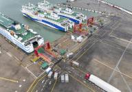 VCG111395493374 QIONGHAI, CHINA - AUGUST 08: Aerial view of trucks boarding ro-ro ships at Xinhai Port on August 8, 2022 in Qionghai, Hainan Province of China. Hainan has adopted stricter measures to curb COVID-19 spread. Those leaving Hainan Island through the Qiongzhou Straits are required to present negative nucleic acid test reports. (Photo by Luo Yunfei\/China News Service