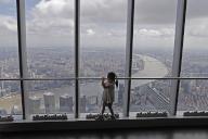 VCG111389976471 SHANGHAI, CHINA - JULY 01: A child enjoys view from "The Top of Shanghai", which reopens with 50 percent of limited capacity, at Shanghai Tower on July 1, 2022 in Shanghai, China. More than 50 percent of 134 Class A tourist attractions in Shanghai reopened with controlled capacity on Friday amid the city\'s return to normalcy. About 80 tourist attractions in the city are expected to reopen by July 8. (Photo by Yin Liqin\/China News Service