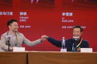 VCG111396478989 BEIJING, CHINA - AUGUST 15: Director Frant Gwo (L) and actor Li Xuejian shake hands at Tiantan Award International Jury Press Conference during the 12th Beijing International Film Festival on August 15, 2022 in Beijing, China. (Photo by VCG
