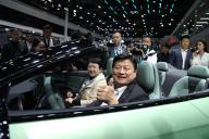VCG111493389367 BEIJING, CHINA - APRIL 28: Fu Kun-chi, head of visiting Chinese Kuomintang party (KMT) delegation, tries a new car during the 2024 Beijing International Automotive Exhibition (Auto China 2024) at China International Exhibition Center on April 28, 2024 in Beijing, China. The 25-member KMT delegation led by Fu Kun-chi, executive director of the Chinese Kuomintang Policy Association, arrived in Beijing on the evening of April 26 and is scheduled to return to Taiwan on April 28. (Photo by Zhu He\/China News Service\/VCG