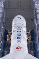 VCG111493527925 WENCHANG, CHINA - APRIL 27: The combination of the Chang\'e-6 lunar probe and the Long March-5 Y8 carrier rocket are transferred vertically to the launching area at the Wenchang Space Launch Center on April 27, 2024 in Wenchang, Hainan Province of China. The Chang\'e-6 lunar probe is scheduled for launch at an appropriate time at the beginning of May, according to the China National Space Administration (CNSA). (Photo by VCG\/VCG