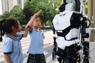 VCG111495409837 MIANYANG, CHINA - MAY 10: A robot, speaking with a Sichuan dialect, stands at an intersection to serve as a traffic guide on May 10, 2024 in Mianyang, Sichuan Province of China. The robot, developed by Mianyang Leju Robot Technology Co., works on the street to promote civilized travel among citizens. (Photo by Chen Dongdong/VCG 