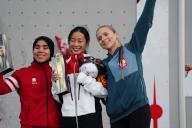 VCG111496818316 SHANGHAI, CHINA - MAY 18: (L-R) Silver medalist Rajiah Sallsabillah of Indonesia, gold medalist Zhou Yafei of China and bronze medalist Natalia Kalucka of Poland pose with trophies during the medal ceremony for the Sport Climbing Women