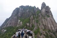 VCG111497134928 HUANGSHAN, CHINA - MAY 20: Tourists visit the Tiandu Peak of Huangshan Mountain on May 20, 2024 in Huangshan City, Anhui Province of China. (Photo by Shi Yalei\/VCG
