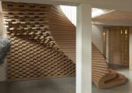 Sculptural curvaceous timber staircase. ACME Offices, London, United Kingdom. Architect: ACME, 2024