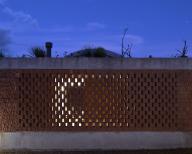 Exterior facade and perforated brick screen. Casa Terreno, n/a, Mexico. Architect: Fernanda Canales, 2018