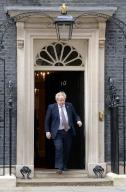 The UK PM Boris Johnson steps from No.10 Downing