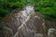 UNITED STATES: May 18, 2018: Heavy rains over the part week that will continue into next week are causing creeks and rivers to overflow their banks. Seen here near the Village of Unison is a roaring Beaverdam Creek. (Photo by Douglas Graham/Loudoun Now)