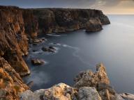 Portugal, Algarve, Scenic cliffs of Vicentine Coast Natural Park at dusk