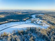 Germany, Baden-Wurttemberg, Aerial view of small snow-covered village in Remstal valley