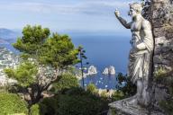 Italy, Capri, Monte Solaro, Ancient statue of Tiberius, View of Faraglioni