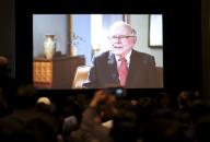 (180505) -- OMAHA, May 5, 2018 (Xinhua) -- Participants watch a video of an interview of U.S. billionaire investor Warren Buffett in Omaha, the United States, May 4, 2018, one day prior to the Berkshire Hathaway