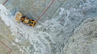 (221113) -- XAYAR, Nov. 13, 2022 (Xinhua) -- This aerial photo taken on Nov. 11, 2022 shows a vehicle working at a cotton company in Xayar County, northwest China