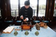 (221130) -- CHANGXING, Nov. 30, 2022 (Xinhua) -- Lin Ruiyang, an inheritor of Zisun tea making techniques, boils tea in a traditional way in Changxing County, east China