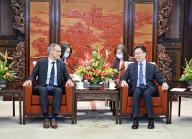 (230329) -- BEIJING, March 29, 2023 (Xinhua) -- Chinese Vice President Han Zheng meets with Schneider Electric Chairman and Chief Executive Officer Jean-Pascal Tricoire, who attends the China Development Forum 2023, in Beijing, capital of China, March 29, 2023. (Xinhua/Yin Bogu