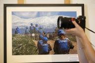 (230616) -- BEIRUT, June 16, 2023 (Xinhua) -- A woman takes a picture at a photo exhibition of the United Nations Interim Force in Lebanon (UNIFIL) in Beirut, Lebanon, on June 16, 2023. On the occasion of the 75th anniversary of the UN peacekeeping operations, the UNIFIL photo exhibition kicked off here on Friday. (Xinhua/Bilal Jawich