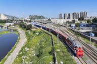 (230829) -- ZHANGJIAKOU, Aug. 29, 2023 (Xinhua) -- This aerial photo taken on Aug. 29, 2023 shows a freight train loaded with auto parts, home appliances and textile products pulling out of the Xiahuayuan railway cargo terminal in Zhangjiakou, north China