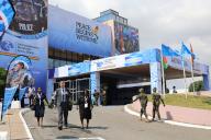(231206) -- ACCRA, Dec. 6, 2023 (Xinhua) -- Delegates walk past the venue of the 2023 United Nations Peacekeeping Ministerial Meeting in Accra, Ghana, on Dec. 6, 2023. The 2023 United Nations (UN) Peacekeeping Ministerial Meeting opened here Wednesday to seek solutions to challenges facing UN peacekeeping and work toward concrete outcomes to enhance the effectiveness of peacekeeping operations worldwide. (Photo by Seth/Xinhua