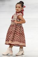 (240329) -- JAKARTA, March 29, 2024 (Xinhua) -- A girl presents a creation during Indonesia Fashion Week 2024 in Jakarta, Indonesia, on March 29, 2024. (Xinhua\/Agung Kuncahya B