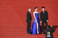(240419) -- BEIJING, April 19, 2024 (Xinhua) -- Actress Lan Yingying (C) and actor Liu Yichang (R) pose for a group photo on the red carpet of the 14th Beijing International Film Festival (BJIFF) in Beijing, capital of China, April 18, 2024. The 14th BJIFF kicked off on Thursday in the Chinese capital, welcoming filmmakers from home and abroad to discuss movie development and promote cultural exchanges in the industry. Members of 14th Tiantan Award jury of this year\'s BJIFF, led by Serbian director Emir Kusturica as jury president, appeared at the opening ceremony. A total of 1,509 films from 118 countries and regions applied to the competition this year, with 15 selected to contend for the Tiantan Award. (Xinhua\/Chen Zhonghao